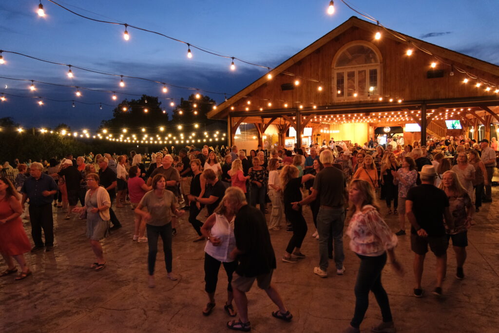 A crowd of people dancing outside of The Hangtime, a premier spot for Ithaca shows